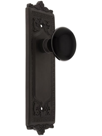 Egg and Dart Plate with Black Porcelain Knob without Keyhole in Oil Rubbed Bronze.